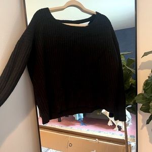 Black knit sweater with scoop back